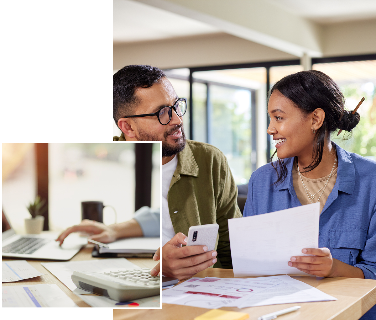 Couple reviewing documents and using calculator.